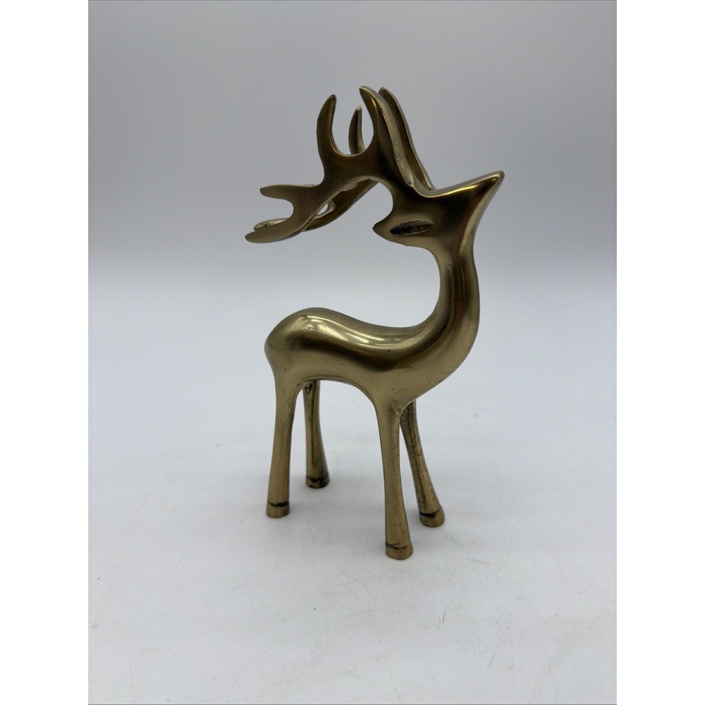 vintage polished brass or gold-toned metal reindeer figurine
